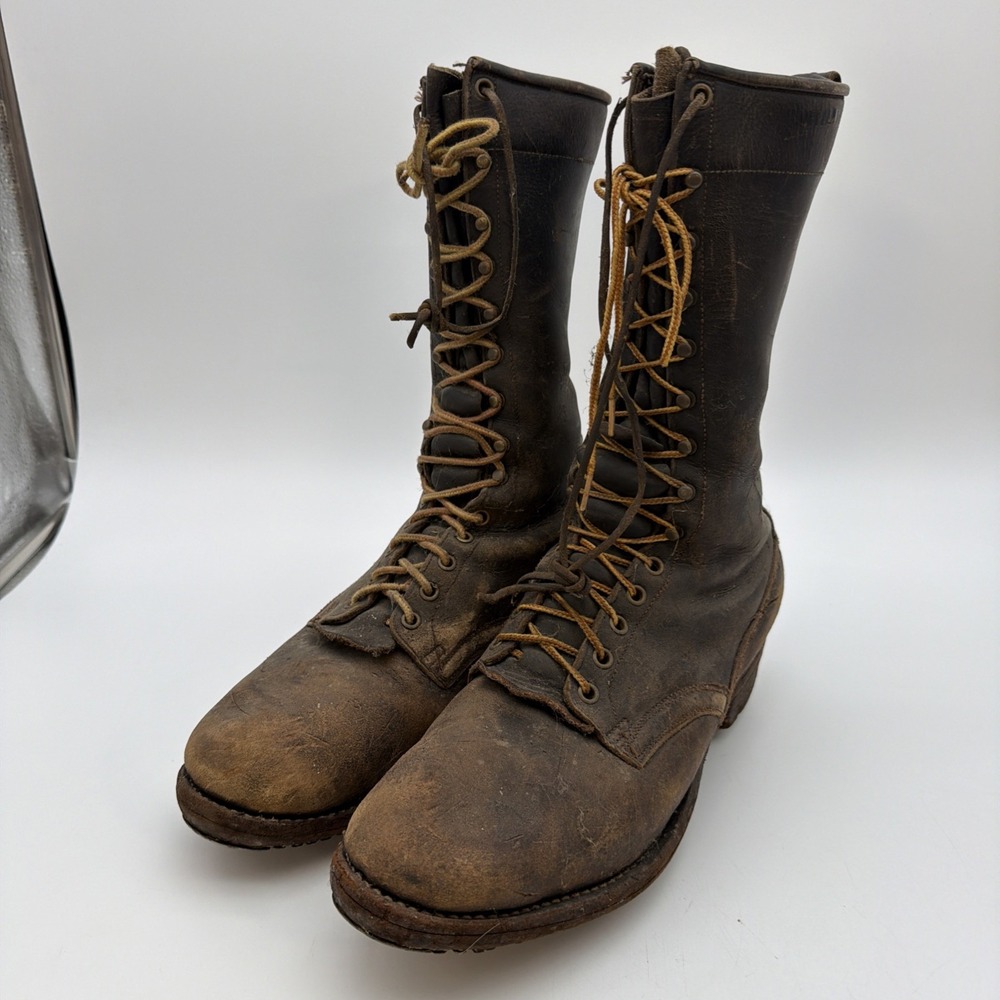 pair of distressed brown leather lace-up logger boots